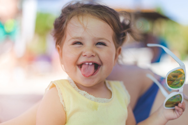 Child sticking out her tongue.