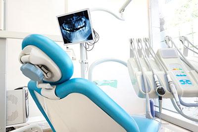 IV sedation in dental exam room with x-ray image